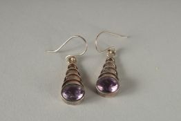 A PAIR OF SILVER AND AMETHYST EARRINGS.