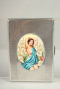 AN ENGINE TURNED SILVER CIGARETTE CASE. Birmingham, 1938 with an oval of glamour semi-nudes..