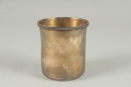 A PLAIN GEORGE III SILVER BEAKER by PAUL STORR. 3.5ins high. Signed, London 1818.