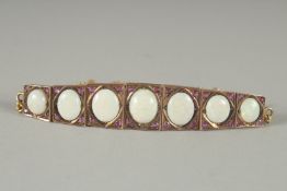 A GOOD GOLD AND SEVEN STONE OPAL BRACELET.