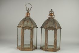 A PAIR OF FILIGREE HEXAGONAL COPPER LANTERNS. 19ins long.