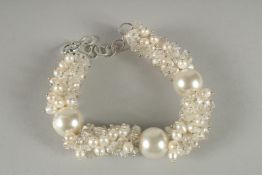 A SILVER, PEARL AND CRYSTAL BRACELET.