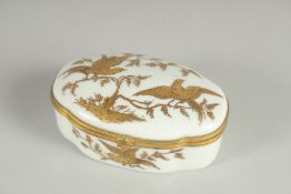 A FRENCH VILLE FAUCHEUR PORCELAIN OVAL BOX decorated with birds. 3.5ins high.