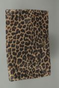 A PRADA LEOPARD PRINT CLUTCH BAG. 9.5ins long, 6ins high in a dust bag.
