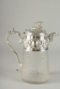 A LARGE CUT GLASS AND SILVER PLATED GREEN CLARET JUG. 10ins high.