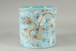 A CHINESE PORCELAIN BLUE DRAGON BRUSH POT. 8ins high.