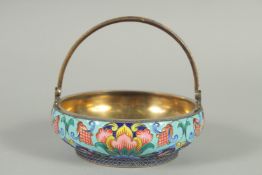A RUSSIAN CIRCULAR SILVER AND ENAMEL SUGAR BASKET with swivel handles. 10.5cm diameter, 3.5cm