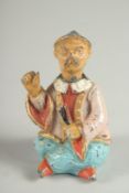 A SMALL PAINTED RETRO NODDING MAN. 2.5ins high.