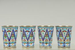 A SET OF FOUR RUSSIAN SILVER AND ENAMEL VODKA TOTS. 5cm high. Mark: Head, 84, K.T. Weight: 134gms.