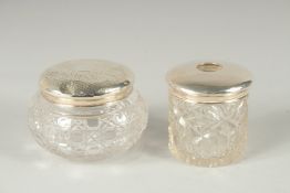 A SILVER TOP STRING TIDY and a silver top cut glass powder bowl (2).