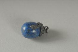 A SILVER LAPIS EGG.