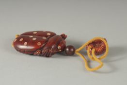 A HARDWOOD BEETLE INRO with rope. 4ins.