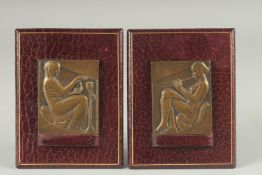A PAIR OF ART NOUVEAU CAST BRONZE RELIEFS on leather strut frames. 2.75ins x 2.25ins.