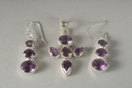 A PAIR OF SILVER AND AMETHYST EARRINGS and a pendant.