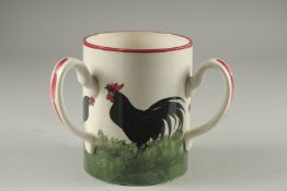 A WEMYSS POTTERY TYG hand painted with black cockerels on a green base. Impressed 