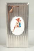 AN ENGINE TURNED SILVER CIGARETTE CASE. Sheffield 1958 with a glamour girl.