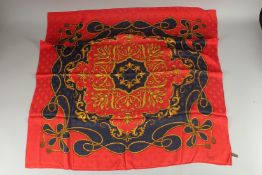 AN ASPREY RED AND BLUE SILK SCARF. 33ins x 33ins in an Asprey box.