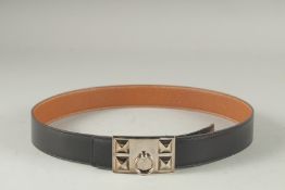 A BROWN LEATHER HERMES PARIS BELT. 36ins long.