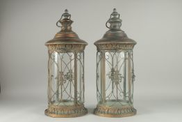 A PAIR OF COPPER CIRCULAR LANTERNS. 22ins high.