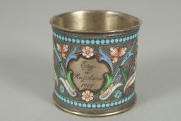 A RUSSIAN SILVER AND ENAMEL EGG CUP. 4.5cm diameter, 4.5ins high. Weight 33gms. Inscribed and dated,