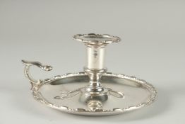 AN OLD SHEFFIELD PLATE CIRCULAR CHAMBER CANDLESTICK. 6ins high.