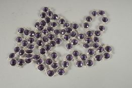 A GOOD SILVER AMETHYST LONG GUARD CHAIN. 48ins long.