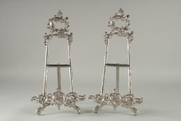 A PAIR OF SILVER PLATED EASLES.