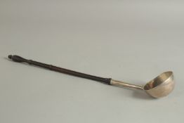 A GEORGE II SILVER TODDY LADLE. London 1743. Maker: David Hennell. 15ins long.