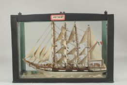 A GLASS CASED SAILING VESSEL 
