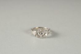 A 9CT GOLD CALDDAGH RING