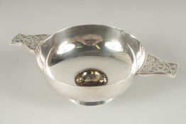 A GOOD ART DECO CIRCULAR QUAICH set with a brilliant cut stone. 4ins diameter.