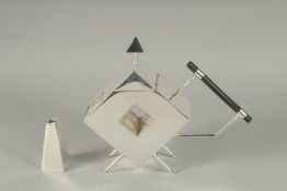 A CHRISTOPHER DRESSER STYLE SILVER PLATED, SQUARE, WITH HOLE, TEAPOT.