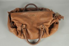 A LARGE MIU MIU SOFT BROWN LEATHER BAG. 16ins long.