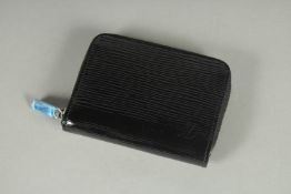 A LOUIS VUITTON BLACK PATENT LEATHER PURSE, as new. 4.5ins long.