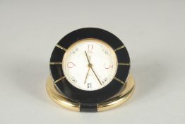 AN YVES ST. LAURENT QUARTZ TRAVELLER WATCH in a pouch.