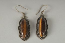 A PAIR OF SILVER AND TIGER'S EYE DROP EARRINGS.