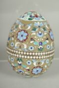 A RUSSIAN SILVER AND ENAMEL EGG 7cm high, 5cm diameter. Mark: 84. Weight: 65gms.