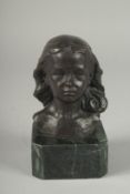 A SMALL BRONZE BUST OF A YOUNG GIRL. Signed, 4ins on a marble base.