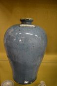 A Chinese blue glazed meiping vase.