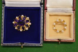 A decorative 9ct gold and gem set brooch together with another brooch.