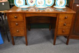 An oak pedestal desk.