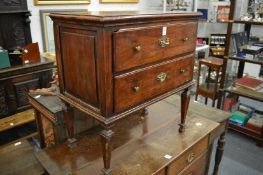 An early two drawer chest.
