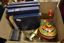 A tin plate child's spinning top, model brass aeroplanes and other items.