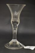 A large plain Georgian glass with inverted bell shaped bowl.