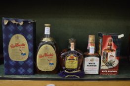 A small bottle of Seagrams Crown Royal Whisky, a bottle Red Hackle Whisky, boxed and a small