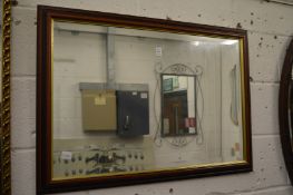 A modern rectangular wall mirror.