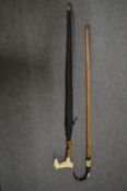 An umbrella, the handle modelled as a horse together with an Alpine walking stick.