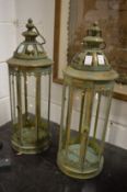 A pair of metal candle lanterns.