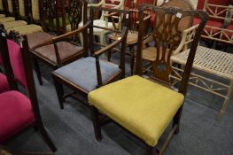 A 19th century mahogany dining chair with arms together with a Chippendale style mahogany dining