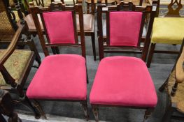 A pair of Victorian walnut dining chairs.
